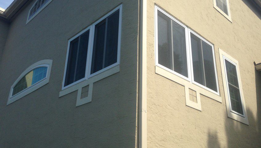 A building with many windows and some signs on it